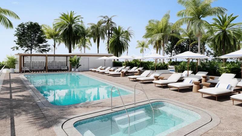 Sunset pool deck at Casamar with spa, pool, and resort seating