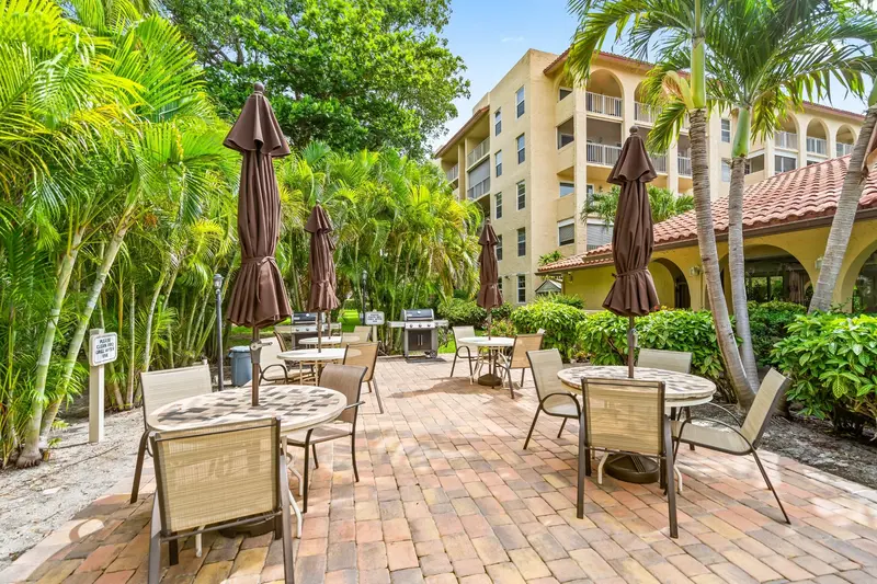 Outdoor patio, seating and barbecue grills at Tierra Del Mar Condos in Boca Raton, Florida
